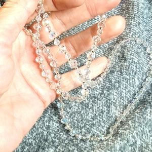 Eye glass strap made with round cut clear glass beads on flexible wire cable.